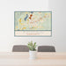 24x36 Pittsfield Massachusetts Map Print Lanscape Orientation in Woodblock Style Behind 2 Chairs Table and Potted Plant