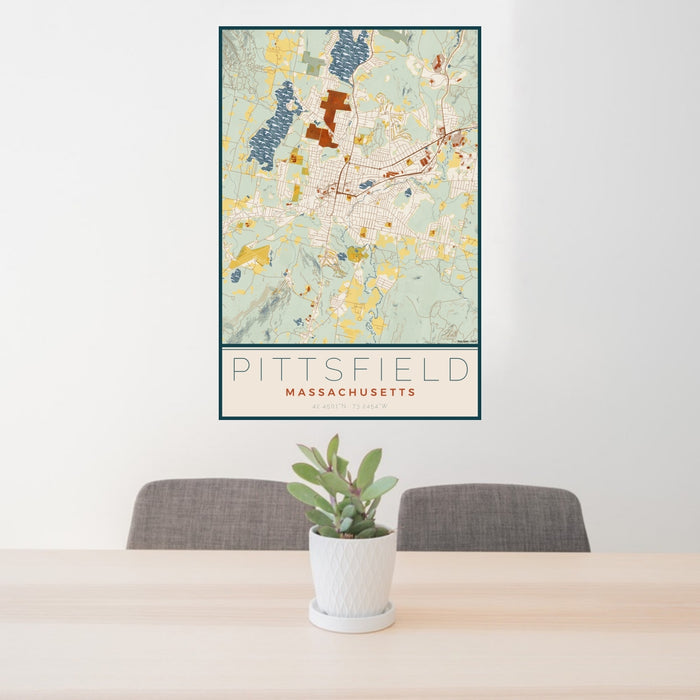 24x36 Pittsfield Massachusetts Map Print Portrait Orientation in Woodblock Style Behind 2 Chairs Table and Potted Plant