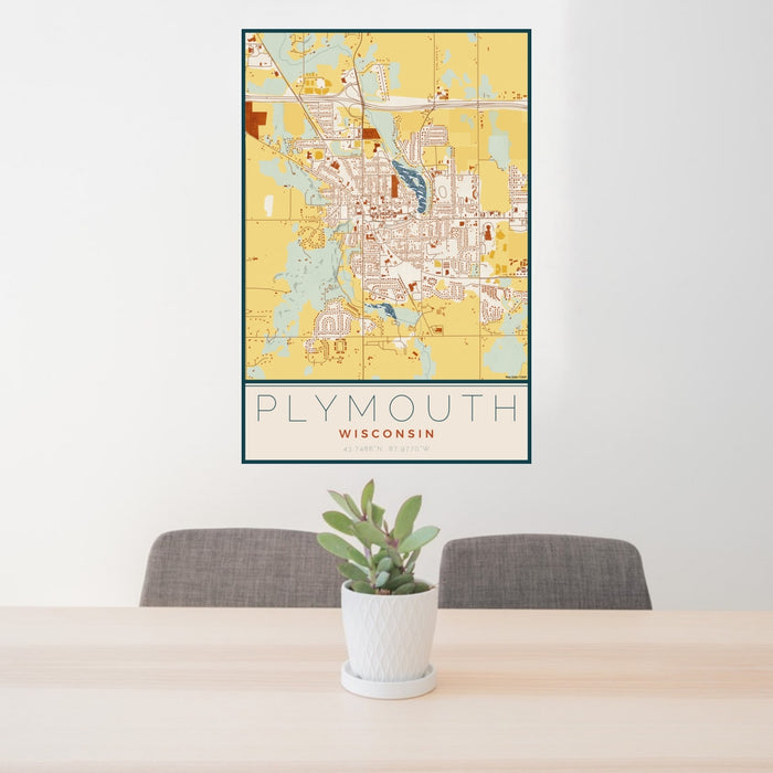 24x36 Plymouth Wisconsin Map Print Portrait Orientation in Woodblock Style Behind 2 Chairs Table and Potted Plant