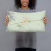 Person holding 20x12 Custom Quartzsite Arizona Map Throw Pillow in Woodblock