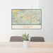 24x36 Ramona California Map Print Lanscape Orientation in Woodblock Style Behind 2 Chairs Table and Potted Plant