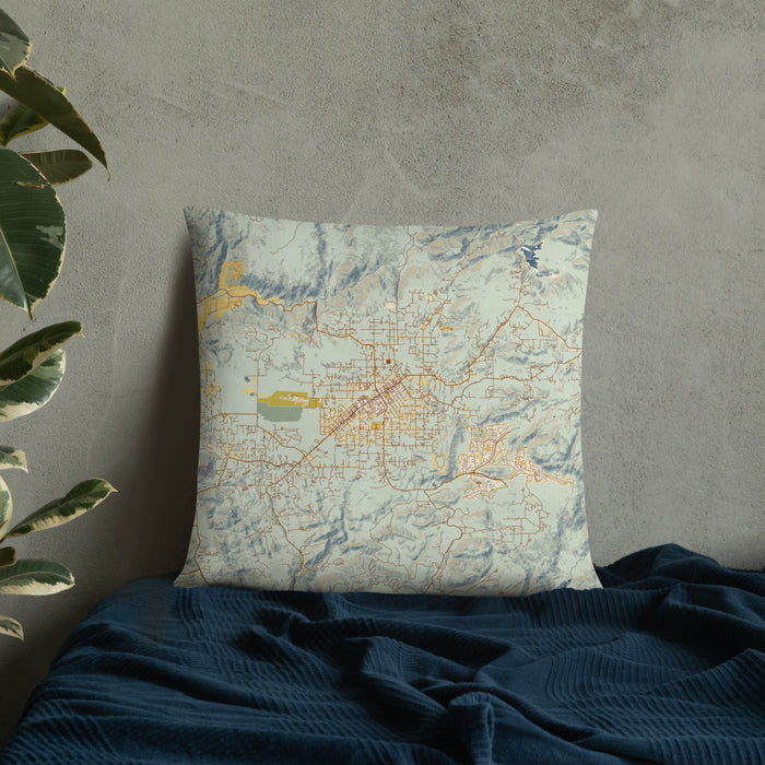 Custom Ramona California Map Throw Pillow in Woodblock on Bedding Against Wall