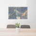 24x36 Revelstoke British Columbia Map Print Lanscape Orientation in Afternoon Style Behind 2 Chairs Table and Potted Plant