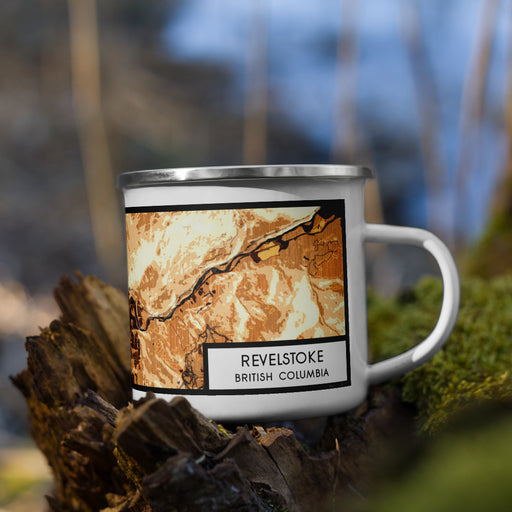 Right View Custom Revelstoke British Columbia Map Enamel Mug in Ember on Grass With Trees in Background