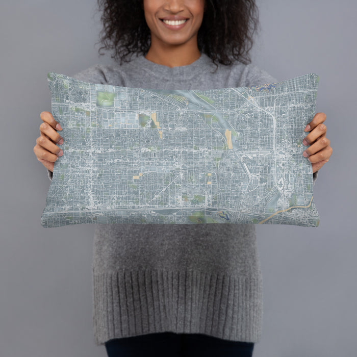Person holding 20x12 Custom Rialto California Map Throw Pillow in Afternoon