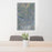 24x36 Rio Grande National Forest Map Print Portrait Orientation in Afternoon Style Behind 2 Chairs Table and Potted Plant