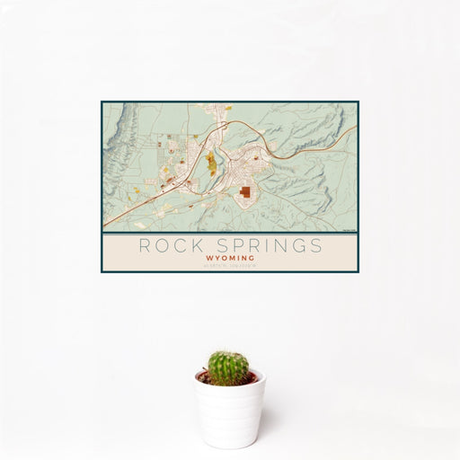 12x18 Rock Springs Wyoming Map Print Landscape Orientation in Woodblock Style With Small Cactus Plant in White Planter