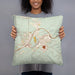 Person holding 18x18 Custom Rock Springs Wyoming Map Throw Pillow in Woodblock