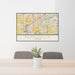 24x36 Romeoville Illinois Map Print Lanscape Orientation in Woodblock Style Behind 2 Chairs Table and Potted Plant