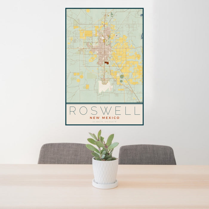 24x36 Roswell New Mexico Map Print Portrait Orientation in Woodblock Style Behind 2 Chairs Table and Potted Plant