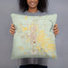 Person holding 18x18 Custom Roswell New Mexico Map Throw Pillow in Woodblock