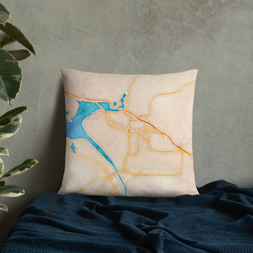 Custom Russellville Arkansas Map Throw Pillow in Watercolor on Bedding Against Wall