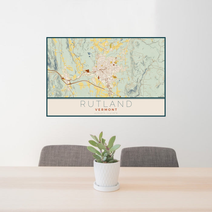 24x36 Rutland Vermont Map Print Lanscape Orientation in Woodblock Style Behind 2 Chairs Table and Potted Plant