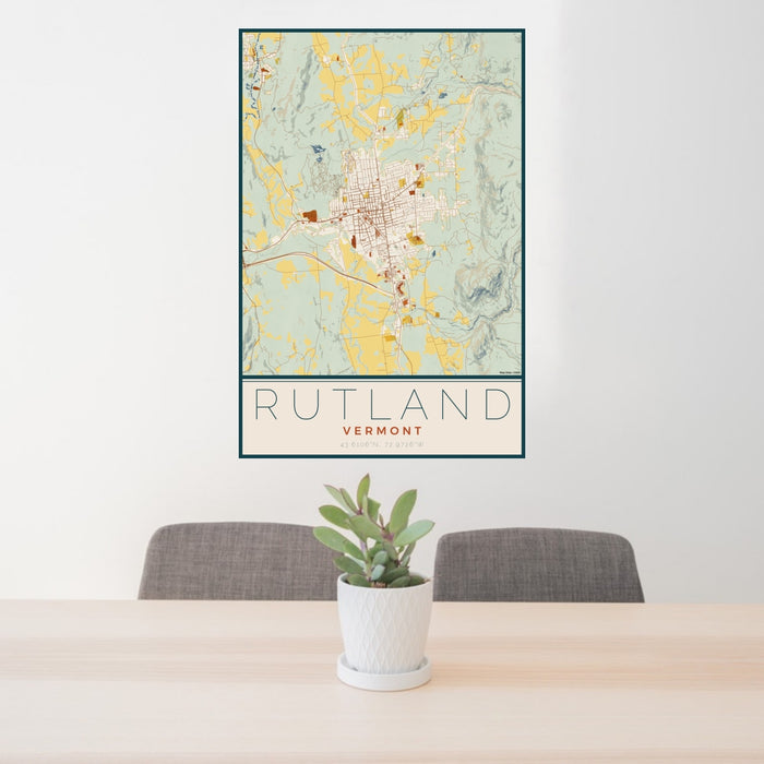 24x36 Rutland Vermont Map Print Portrait Orientation in Woodblock Style Behind 2 Chairs Table and Potted Plant