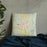 Custom Rutland Vermont Map Throw Pillow in Woodblock on Bedding Against Wall
