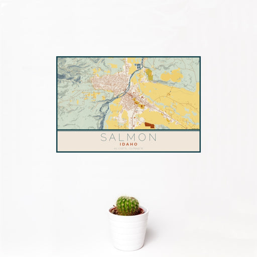 12x18 Salmon Idaho Map Print Landscape Orientation in Woodblock Style With Small Cactus Plant in White Planter