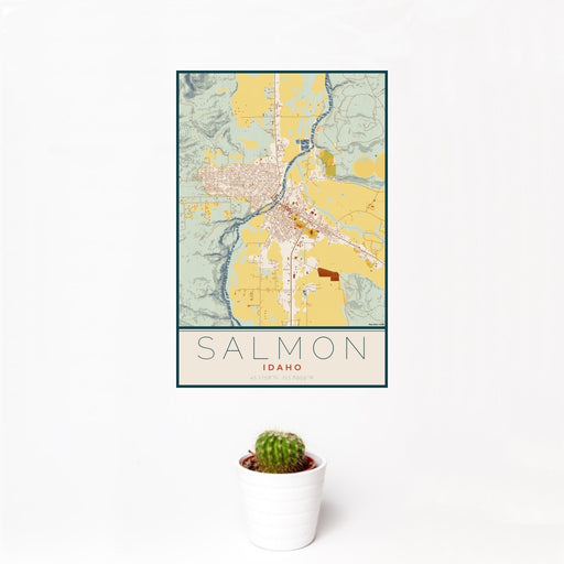 12x18 Salmon Idaho Map Print Portrait Orientation in Woodblock Style With Small Cactus Plant in White Planter