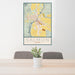 24x36 Salmon Idaho Map Print Portrait Orientation in Woodblock Style Behind 2 Chairs Table and Potted Plant