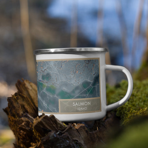 Right View Custom Salmon Idaho Map Enamel Mug in Afternoon on Grass With Trees in Background