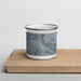 Front View Custom Salmon Idaho Map Enamel Mug in Afternoon on Cutting Board