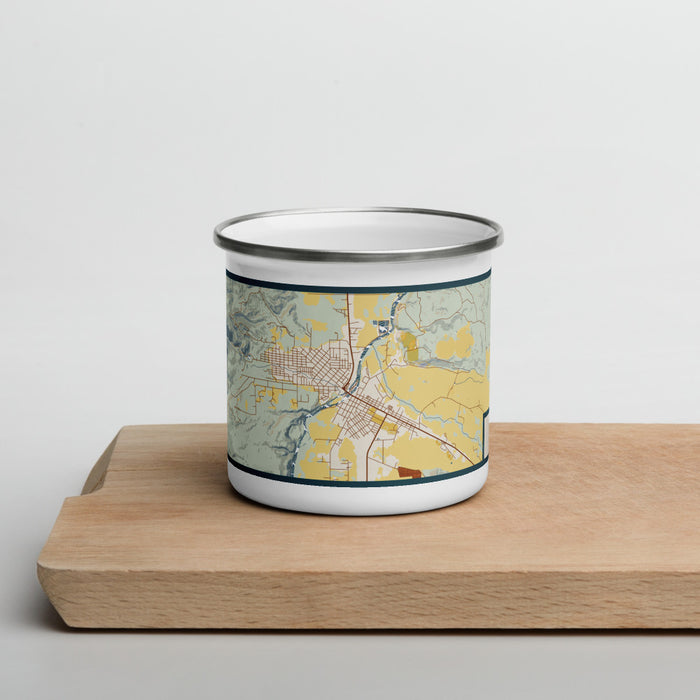 Front View Custom Salmon Idaho Map Enamel Mug in Woodblock on Cutting Board