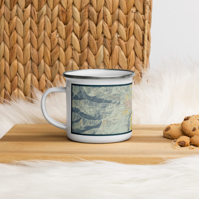 Left View Custom Salmon Idaho Map Enamel Mug in Woodblock on Table Top