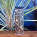 17oz Stainless Steel Insulated Tumbler in White with Custom Ember Style Map In Front of Plants