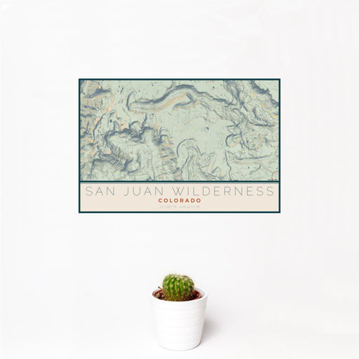 12x18 San Juan Wilderness Colorado Map Print Landscape Orientation in Woodblock Style With Small Cactus Plant in White Planter