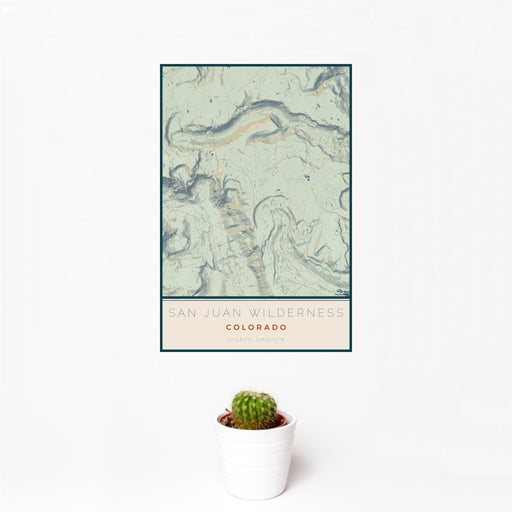 12x18 San Juan Wilderness Colorado Map Print Portrait Orientation in Woodblock Style With Small Cactus Plant in White Planter
