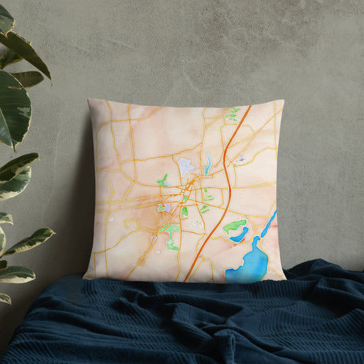 Custom Saratoga Springs New York Map Throw Pillow in Watercolor on Bedding Against Wall
