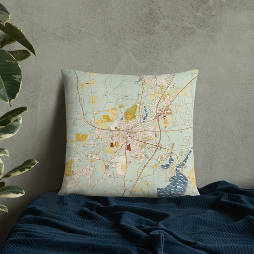 Custom Saratoga Springs New York Map Throw Pillow in Woodblock on Bedding Against Wall