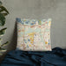 Custom Savage Minnesota Map Throw Pillow in Woodblock on Bedding Against Wall