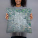 Person holding 18x18 Custom Scottsbluff Nebraska Map Throw Pillow in Afternoon