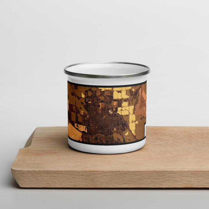 Front View Custom Scottsbluff Nebraska Map Enamel Mug in Ember on Cutting Board