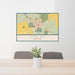 24x36 Shelby Montana Map Print Lanscape Orientation in Woodblock Style Behind 2 Chairs Table and Potted Plant