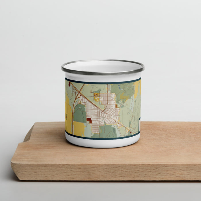 Front View Custom Shelby Montana Map Enamel Mug in Woodblock on Cutting Board