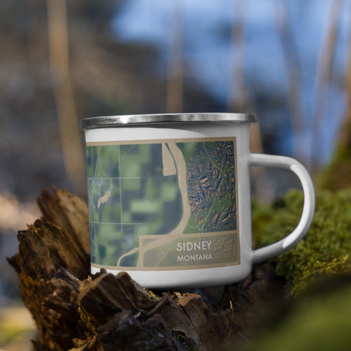 Right View Custom Sidney Montana Map Enamel Mug in Afternoon on Grass With Trees in Background