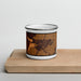 Front View Custom Sidney Montana Map Enamel Mug in Ember on Cutting Board