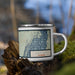 Right View Custom Soda Lake Wyoming Map Enamel Mug in Woodblock on Grass With Trees in Background