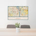 24x36 South Saint Paul Minnesota Map Print Lanscape Orientation in Woodblock Style Behind 2 Chairs Table and Potted Plant