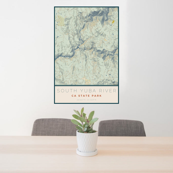 24x36 South Yuba River CA State Park Map Print Portrait Orientation in Woodblock Style Behind 2 Chairs Table and Potted Plant