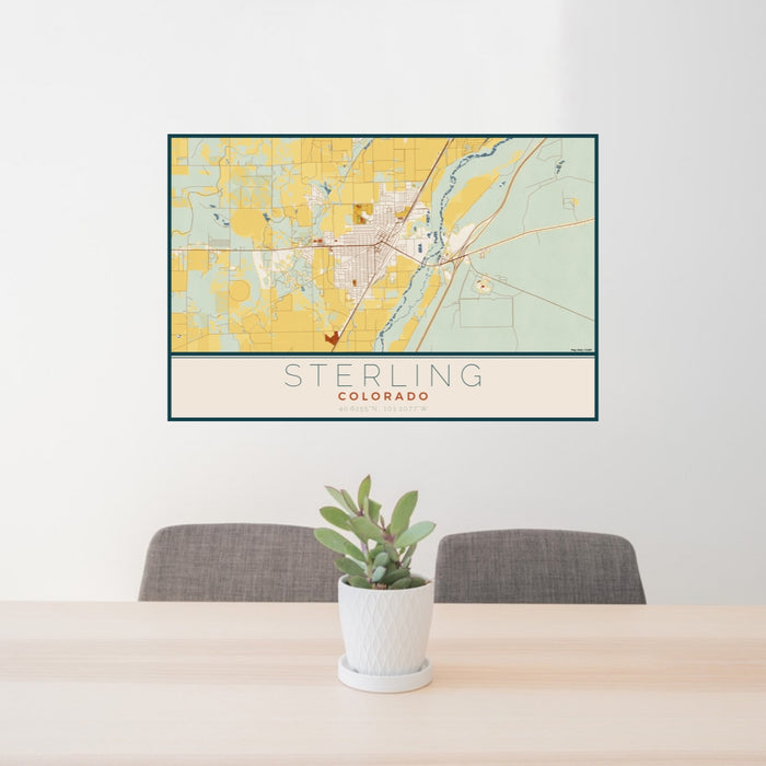 24x36 Sterling Colorado Map Print Lanscape Orientation in Woodblock Style Behind 2 Chairs Table and Potted Plant