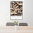 24x36 Swan Range Montana Map Print Portrait Orientation in Ember Style Behind 2 Chairs Table and Potted Plant