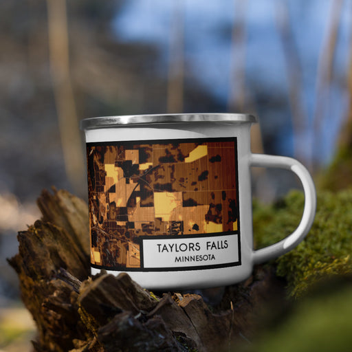 Right View Custom Taylors Falls Minnesota Map Enamel Mug in Ember on Grass With Trees in Background