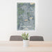 24x36 The Villages Florida Map Print Portrait Orientation in Afternoon Style Behind 2 Chairs Table and Potted Plant