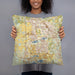 Person holding 18x18 Custom The Villages Florida Map Throw Pillow in Woodblock
