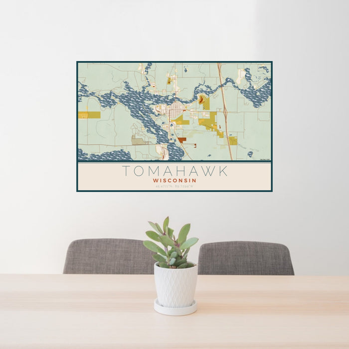 24x36 Tomahawk Wisconsin Map Print Lanscape Orientation in Woodblock Style Behind 2 Chairs Table and Potted Plant