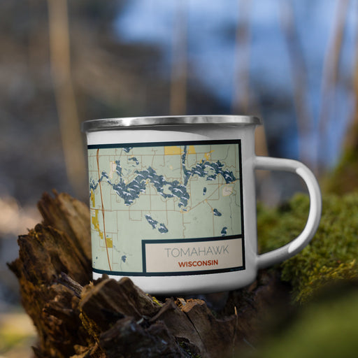 Right View Custom Tomahawk Wisconsin Map Enamel Mug in Woodblock on Grass With Trees in Background