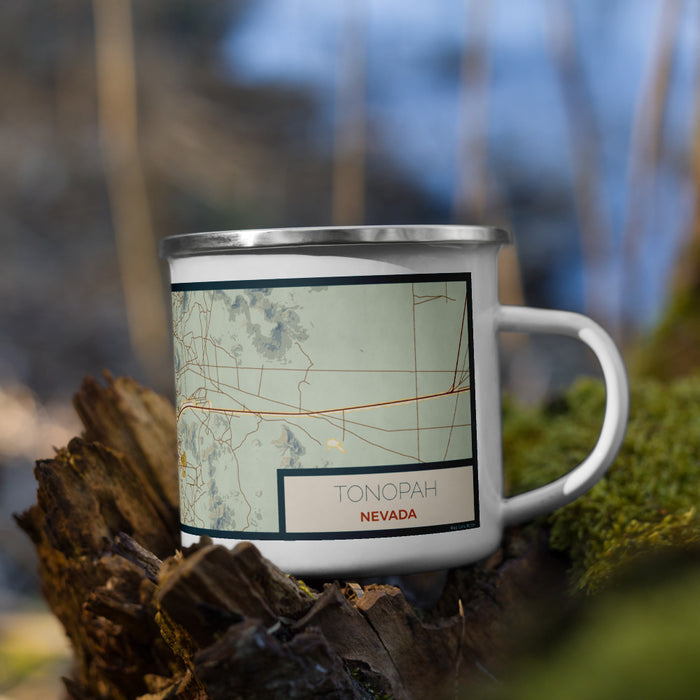 Right View Custom Tonopah Nevada Map Enamel Mug in Woodblock on Grass With Trees in Background