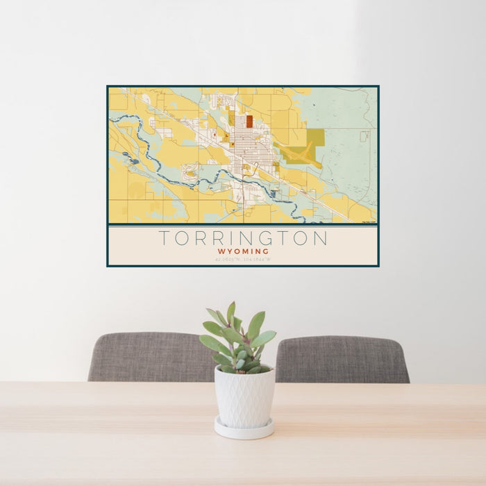 24x36 Torrington Wyoming Map Print Lanscape Orientation in Woodblock Style Behind 2 Chairs Table and Potted Plant